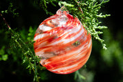 Christmas glass ornament with ash